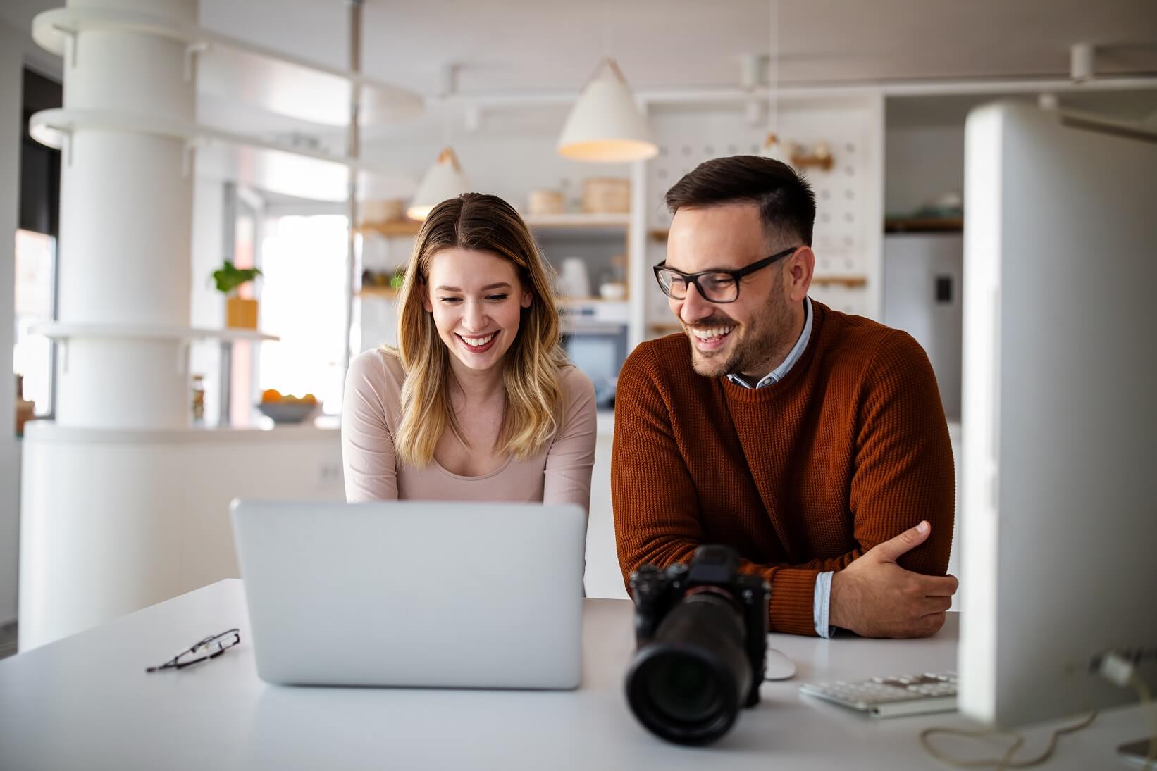 graphic-designers-working-in-office-with-laptop-te-MCCTSRL.jpg