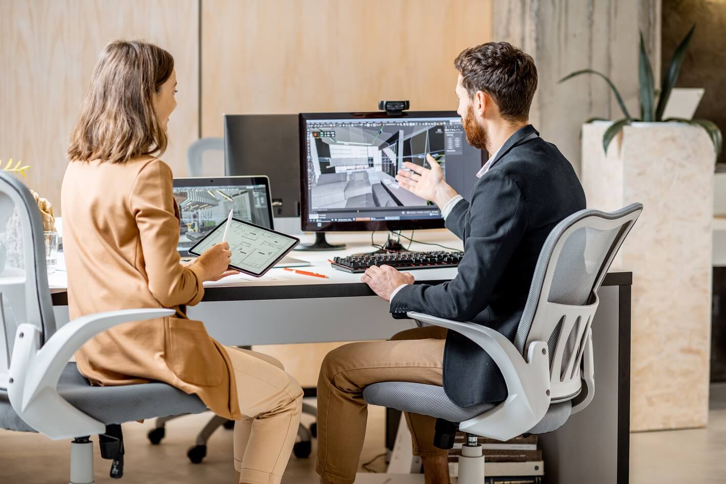two-interior-designers-working-in-the-office-ZANFYNU.jpg
